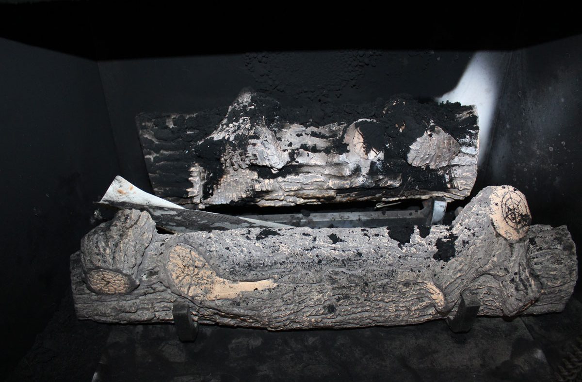 Malfunctioning Gas-Fueled Ceramic Log Set