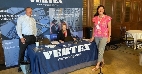 VERTEX memebrs at booth at event